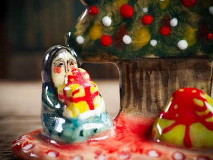 Handmade ceramic Christmas tree scene with child and gifts by Idania Salcido aka Danita Art.