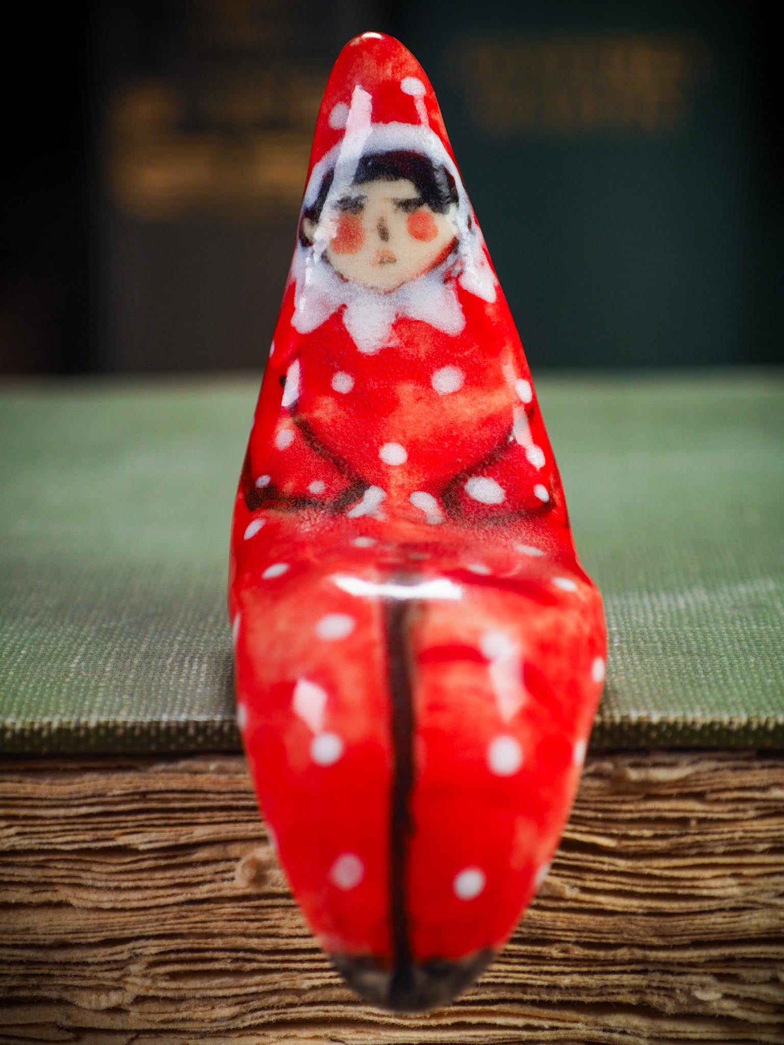 Handmade ceramic red shelf elf companion by Idania Salcido aka Danita Art.