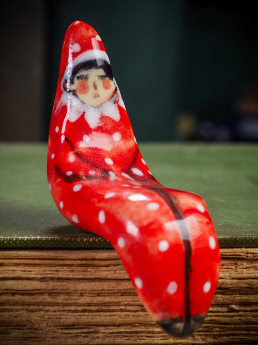 Handmade ceramic red shelf elf companion by Idania Salcido aka Danita Art.