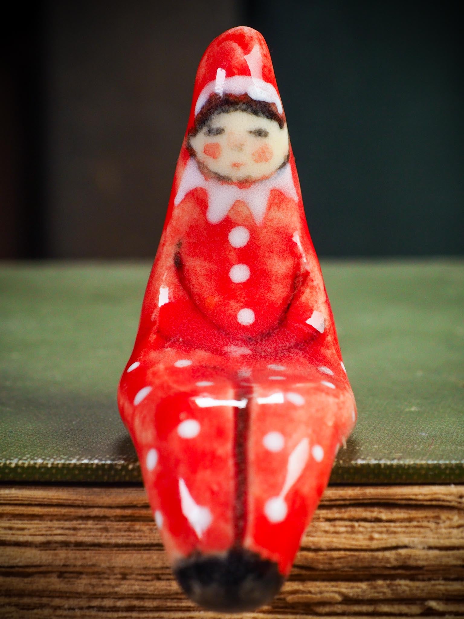 Handmade ceramic red shelf elf companion by Idania Salcido aka Danita Art.