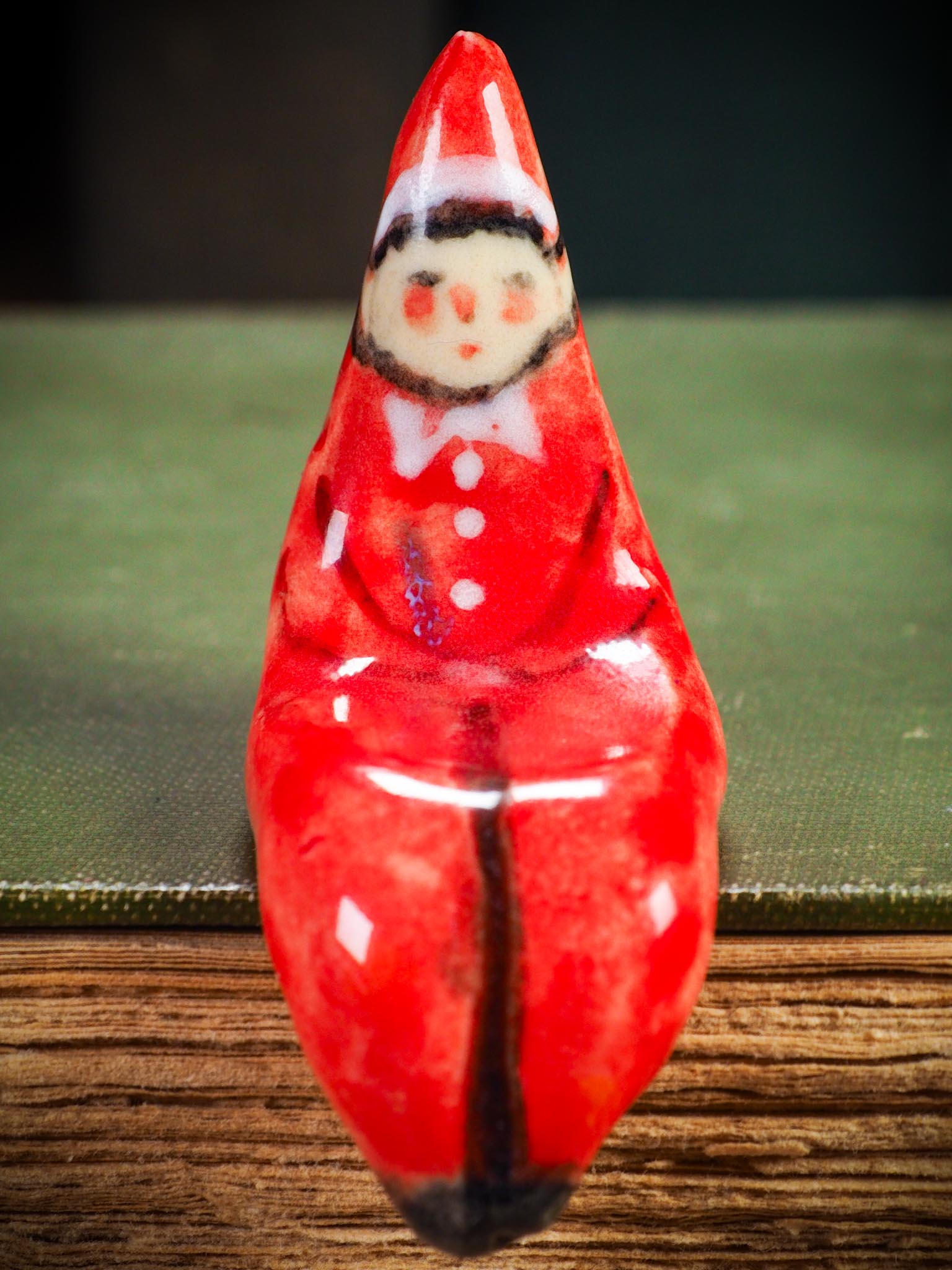 Handmade ceramic red shelf elf companion by Idania Salcido aka Danita Art.