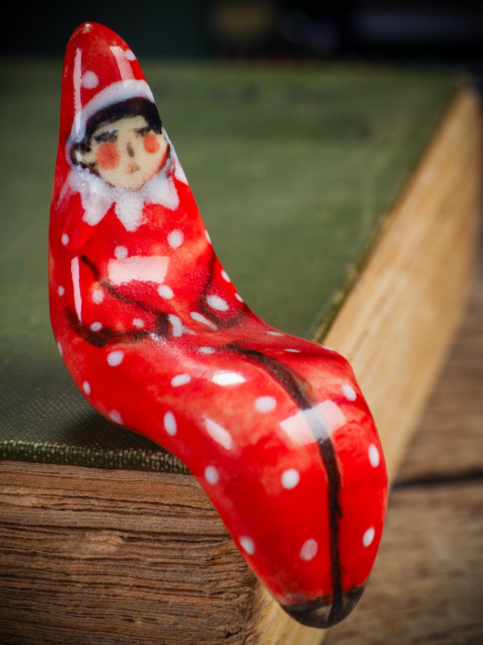 Handmade ceramic red shelf elf companion by Idania Salcido aka Danita Art.