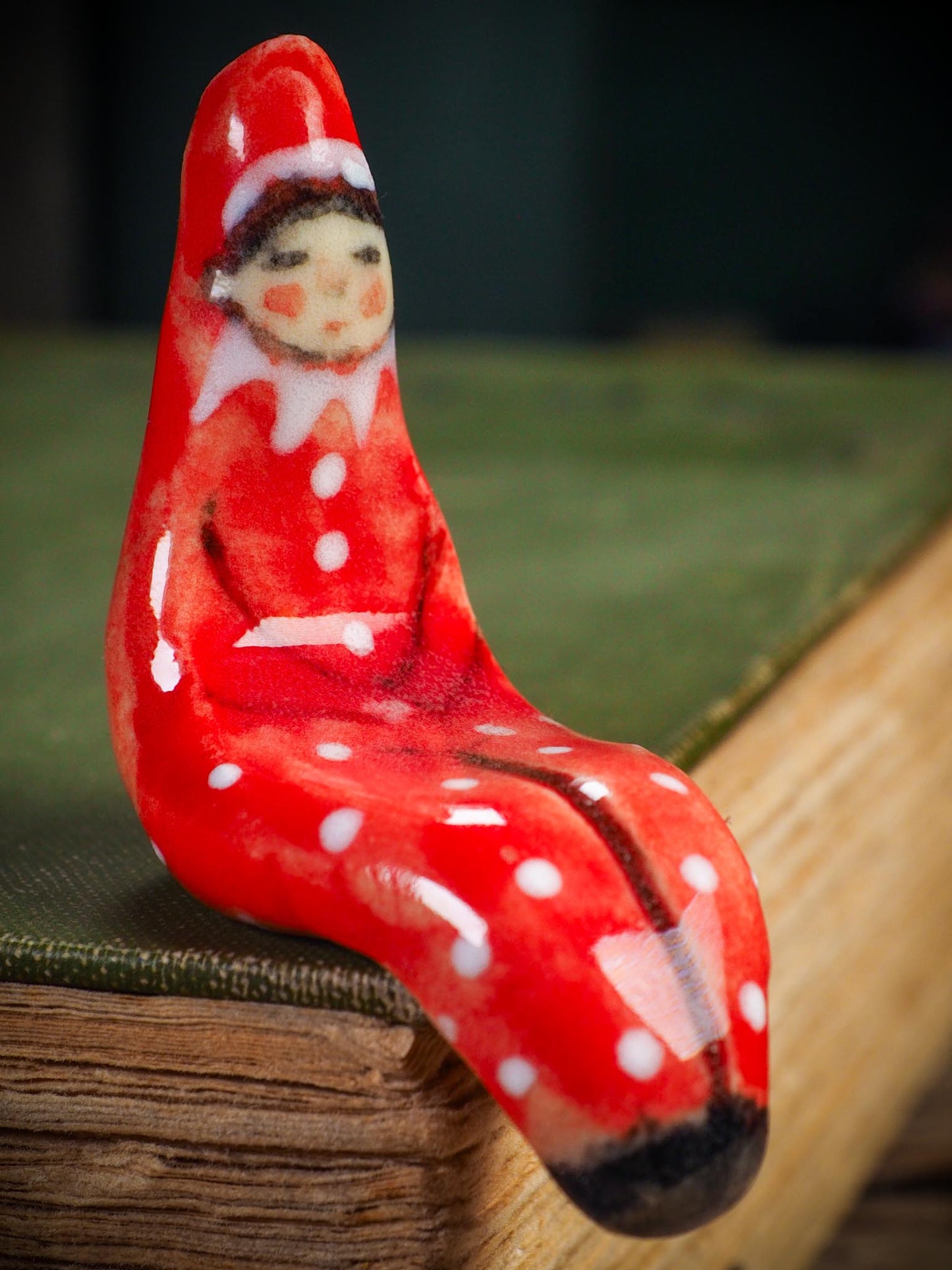 Handmade ceramic red shelf elf companion by Idania Salcido aka Danita Art.