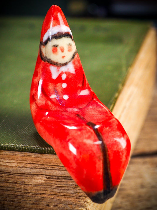 Handmade ceramic red shelf elf companion by Idania Salcido aka Danita Art.