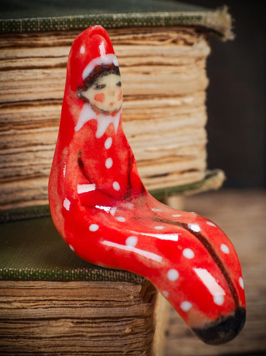 Handmade ceramic red shelf elf companion by Idania Salcido aka Danita Art.