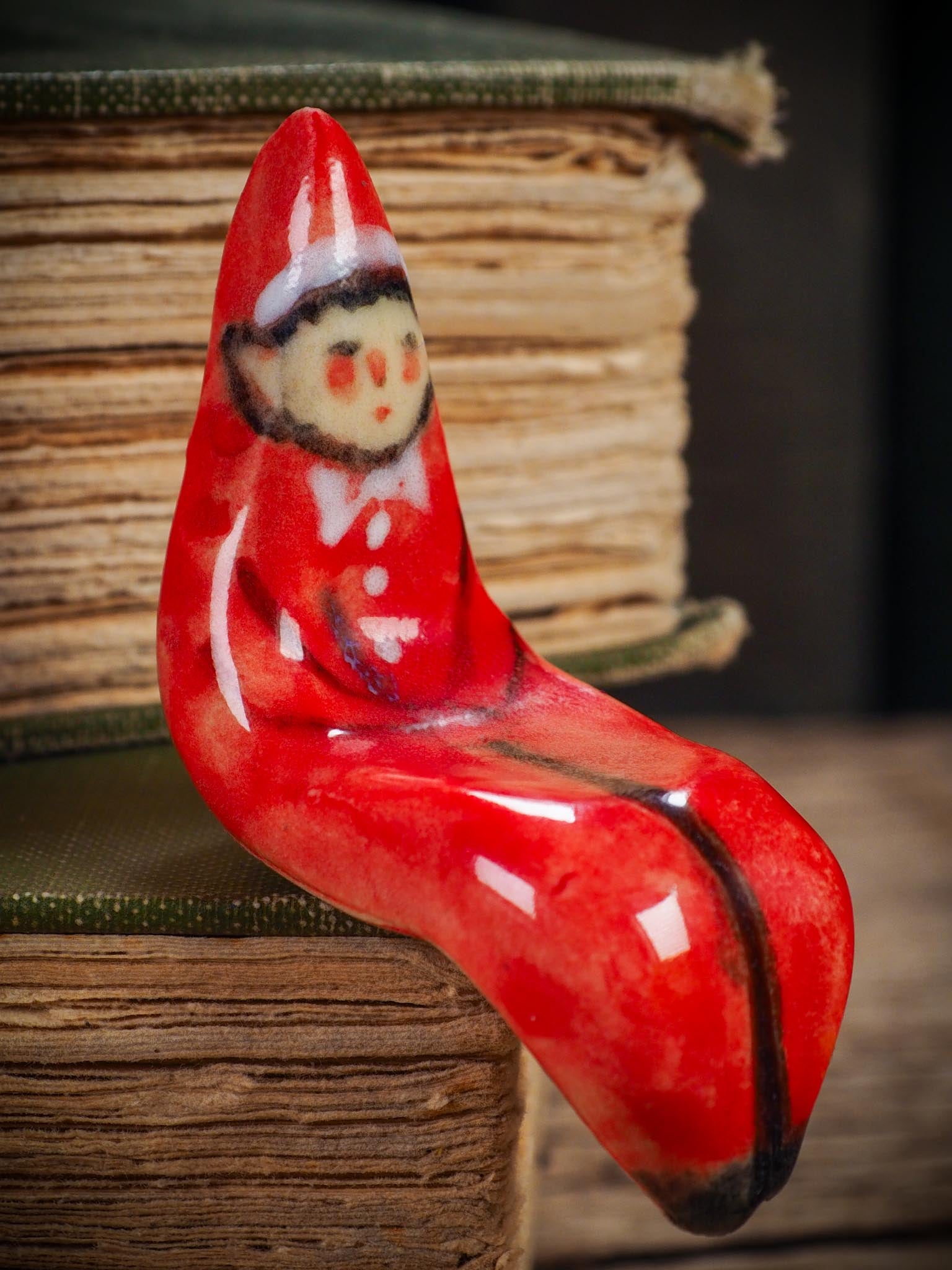 Handmade ceramic red shelf elf companion by Idania Salcido aka Danita Art.