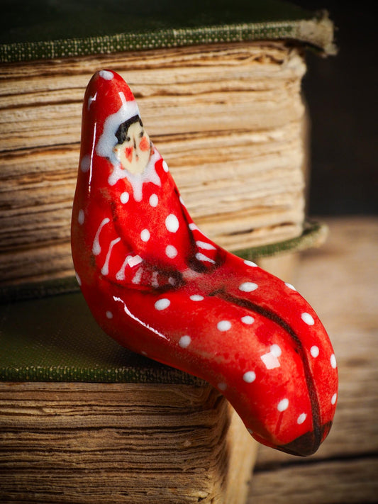 Handmade ceramic red shelf elf companion by Idania Salcido aka Danita Art.