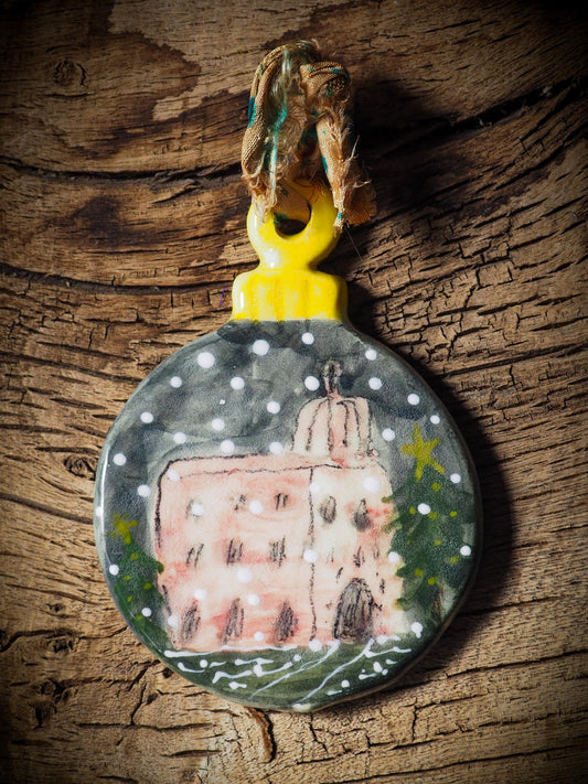 Handmade ceramic ornament with a snowy Christmas house by Idania Salcido aka Danita Art.