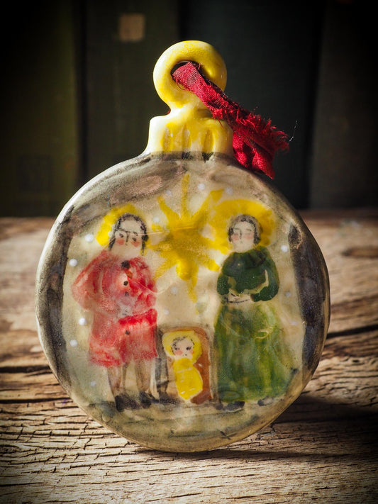 Handmade ceramic nativity ornament with Mary, Joseph, and baby Jesus by Idania Salcido aka Danita Art.