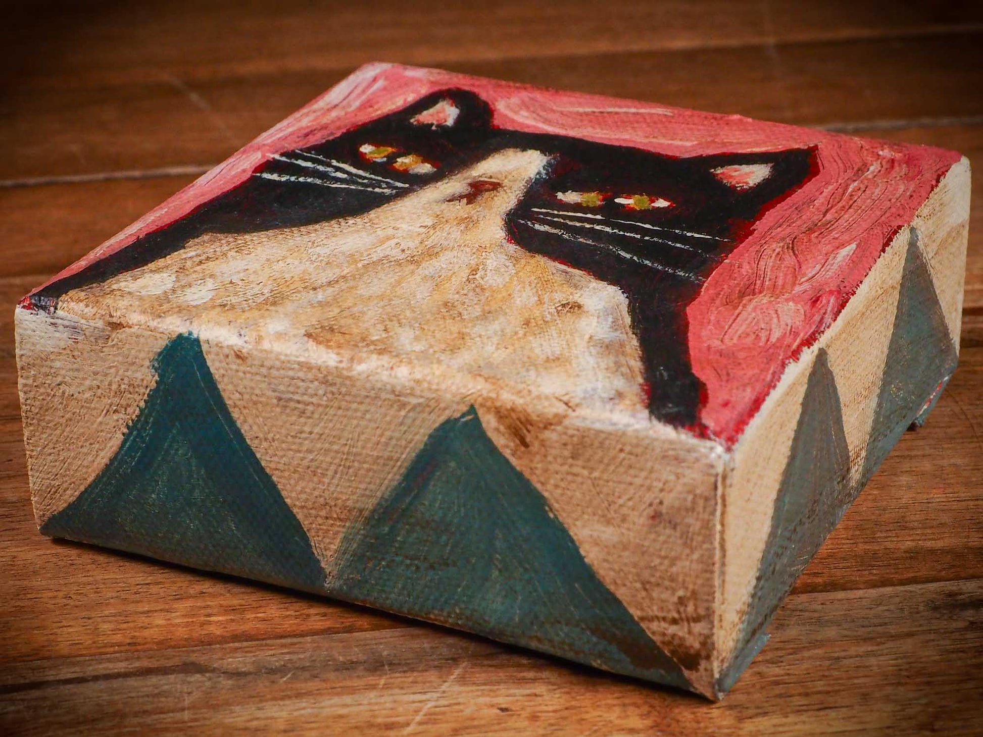 An original acrylic painting by Idania Salcido, Danita Art, depicting a tuxedo cat posing on a serious pose. A cat doing cat things.