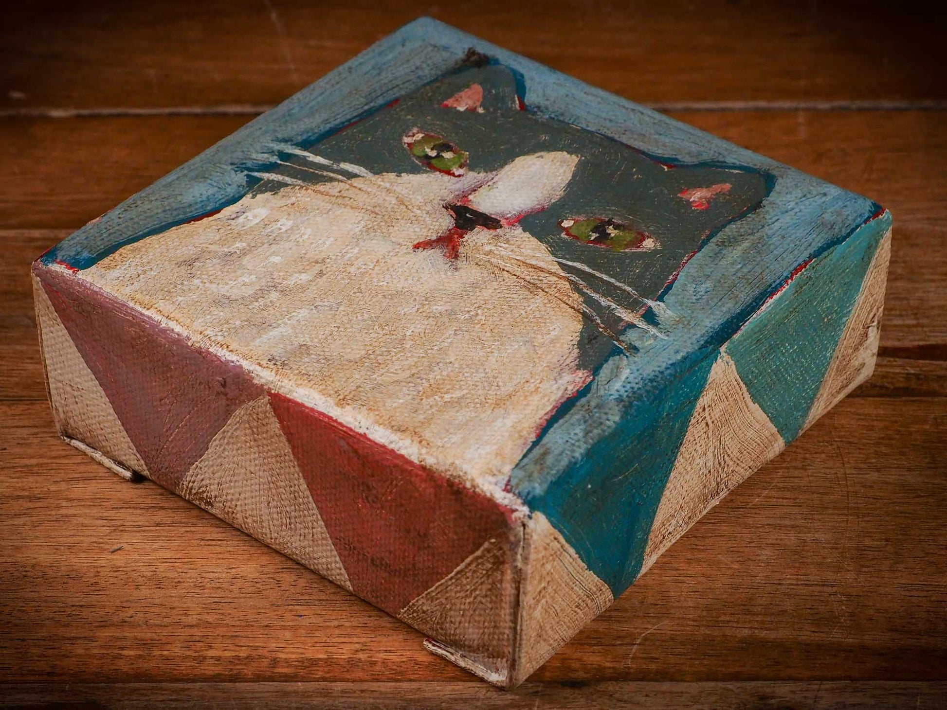 An original acrylic painting by Idania Salcido, Danita Art, depicting a grey cat posing on a serious pose. A cat doing cat things.