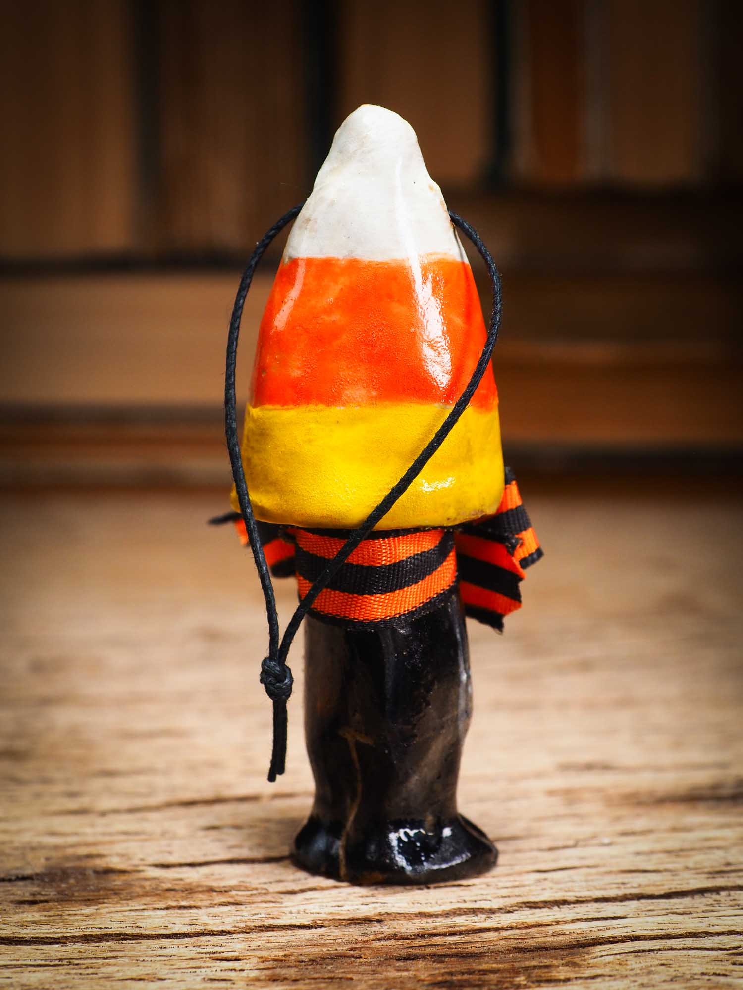 Original handmade ceramic candy corn ornament by Idania Salcido Danita Art with silk bow is perfect Halloween decoration! Stands on its own or hangs from window