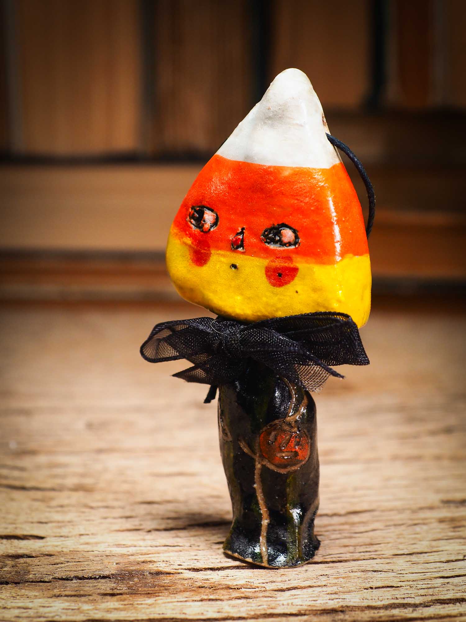 Original handmade ceramic candy corn ornament by Idania Salcido Danita Art with silk bow is perfect Halloween decoration! Stands on its own or hangs from window