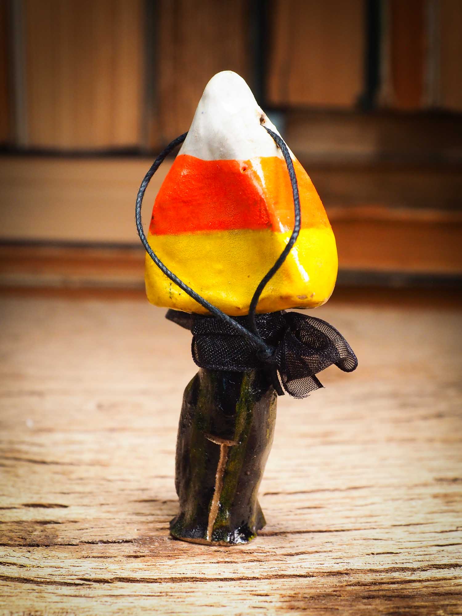 Original handmade ceramic candy corn ornament by Idania Salcido Danita Art with silk bow is perfect Halloween decoration! Stands on its own or hangs from window