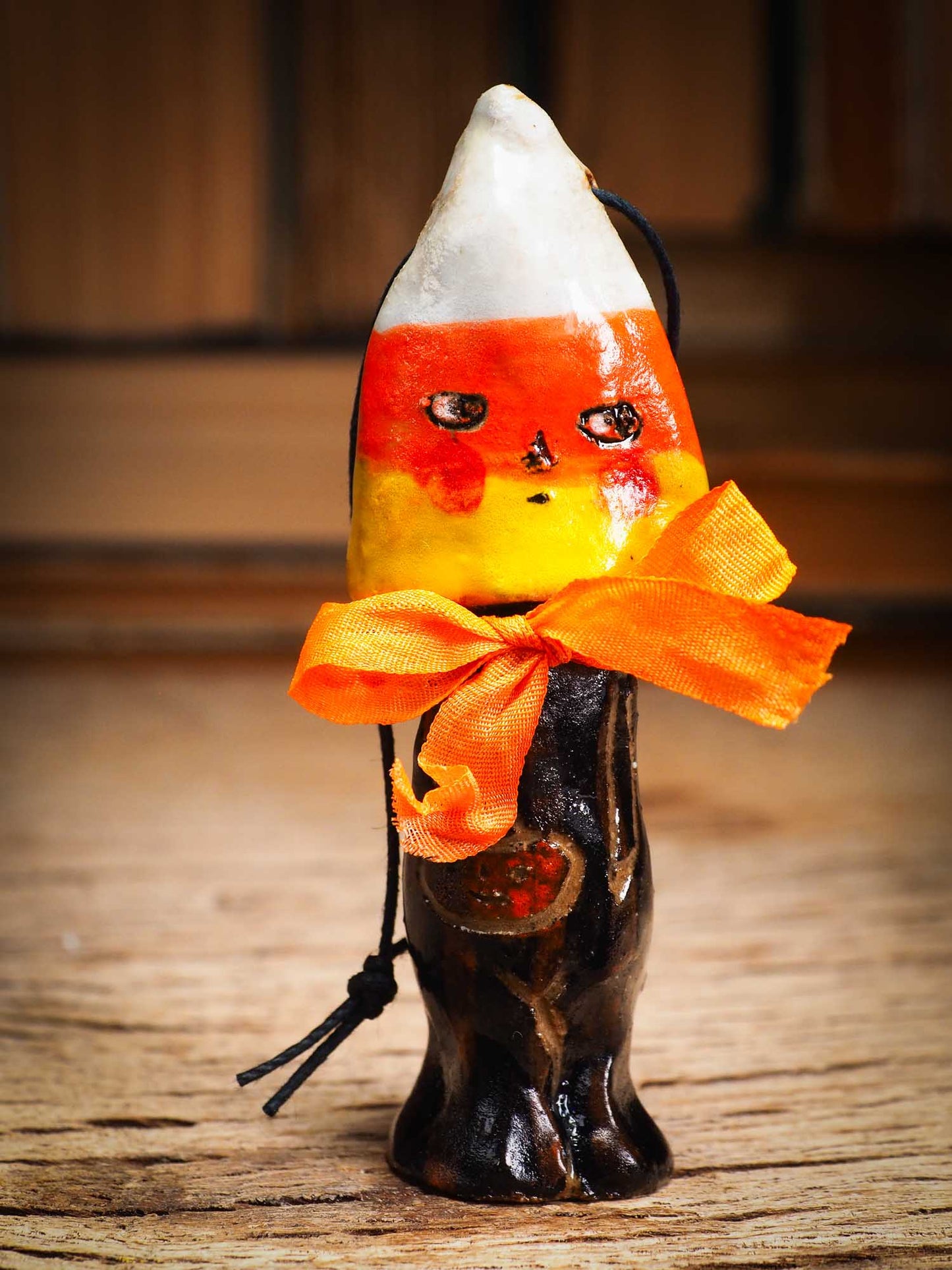 Original handmade ceramic candy corn ornament by Idania Salcido Danita Art with silk bow is perfect Halloween decoration! Stands on its own or hangs from window
