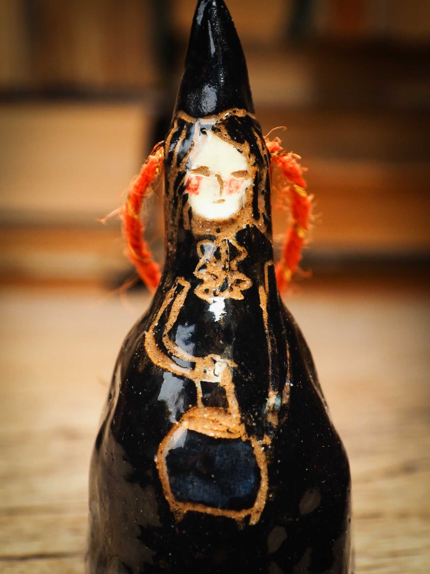 Original handmade ceramic black witch ornament by Idania Salcido Danita Art with thread is perfect Halloween decoration! Stands on its own or hangs from window
