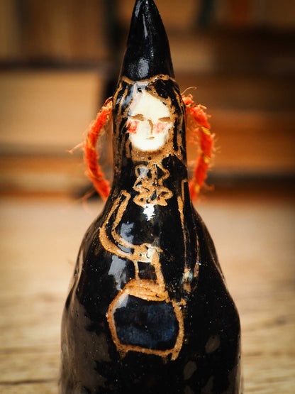 Original handmade ceramic black witch ornament by Idania Salcido Danita Art with thread is perfect Halloween decoration! Stands on its own or hangs from window