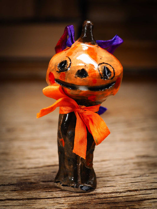 Original handmade ceramic jack-o-lantern pumpkin ornament by Idania Salcido Danita Art is a perfect Halloween decoration! Stands on its own or hangs from window