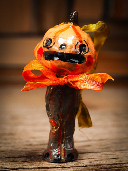 Original handmade ceramic jack-o-lantern pumpkin ornament by Idania Salcido Danita Art is a perfect Halloween decoration! Stands on its own or hangs from window