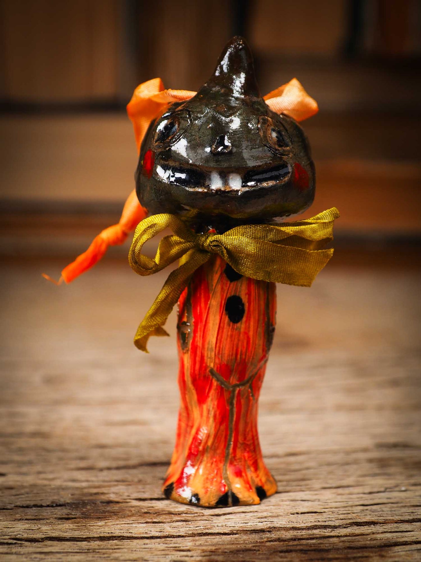 Original handmade ceramic jack-o-lantern pumpkin ornament by Idania Salcido Danita Art is a perfect Halloween decoration! Stands on its own or hangs from window