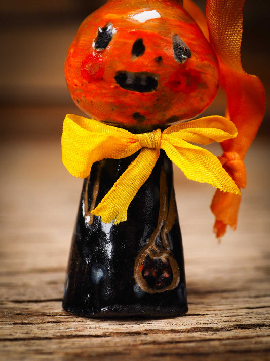 Original handmade ceramic jack-o-lantern pumpkin ornament by Idania Salcido Danita Art is a perfect Halloween decoration! Stands on its own or hangs from window