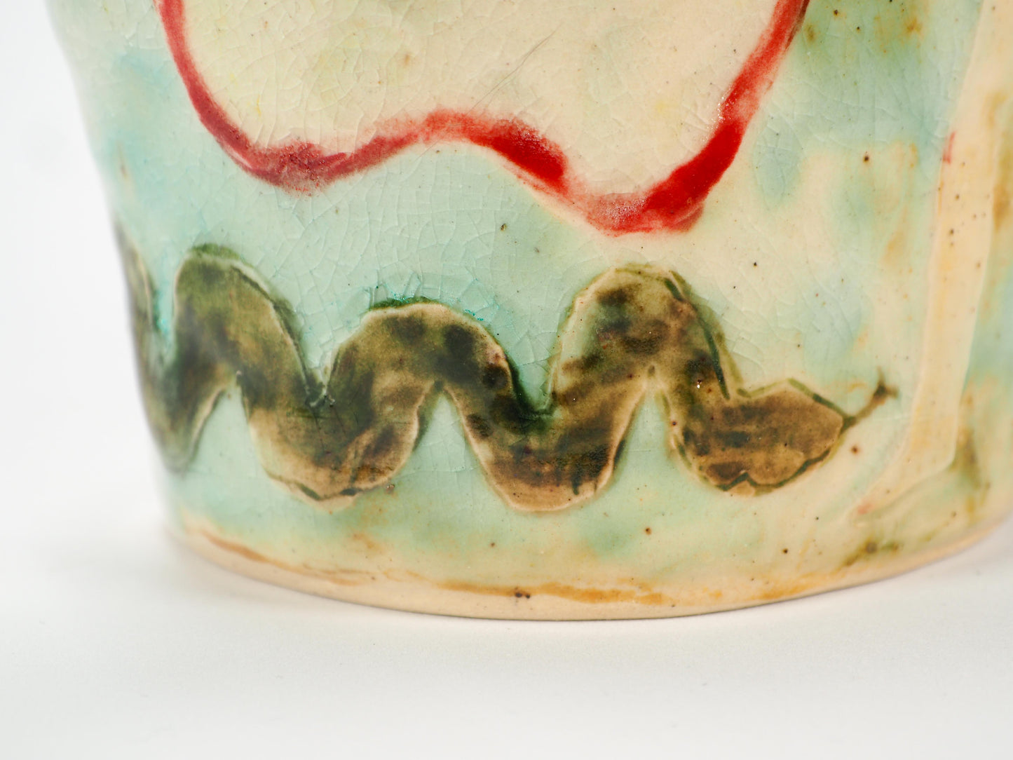 We Could Say No feminist ceramic art vase by Idania Salcido Danita Art featuring carved relief Adam & Eve reaching toward a sliced apple while the serpents lurks nearby.