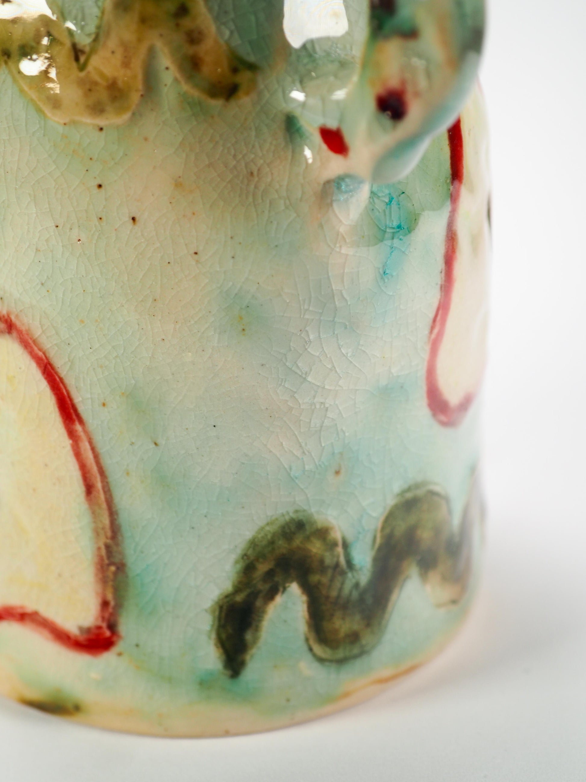 We Could Say No feminist ceramic art vase by Idania Salcido Danita Art featuring carved relief Adam & Eve reaching toward a sliced apple while the serpents lurks nearby.