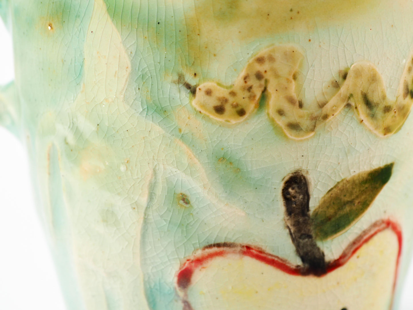 We Could Say No feminist ceramic art vase by Idania Salcido Danita Art featuring carved relief Adam & Eve reaching toward a sliced apple while the serpents lurks nearby.