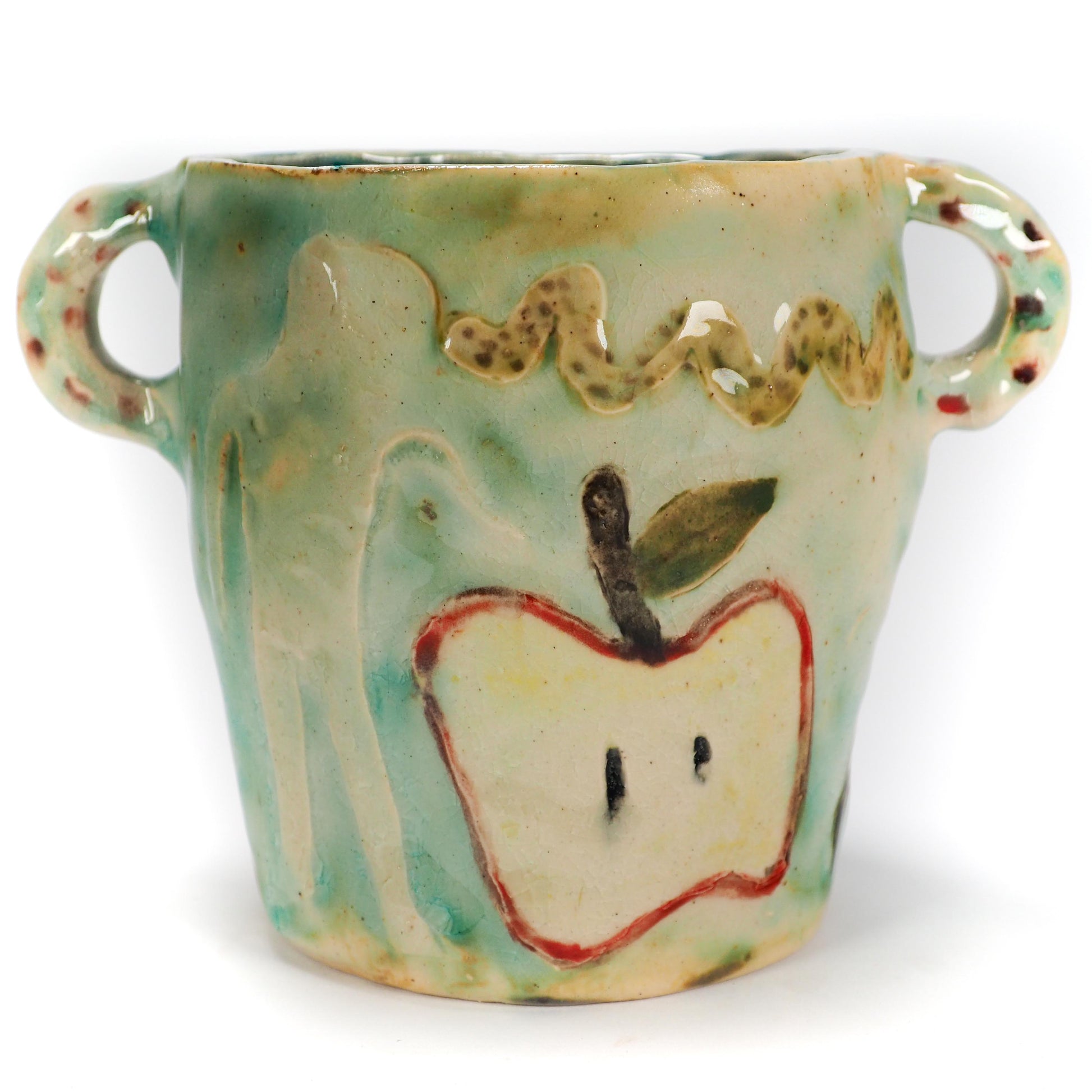 We Could Say No feminist ceramic art vase by Idania Salcido Danita Art featuring carved relief Adam & Eve reaching toward a sliced apple while the serpents lurks nearby.