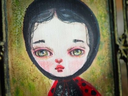 Closeup of the beautiful eyes Danita paints in her original watercolor anthropomorphic surrealist portraits. Ladybug insect bug beetle.