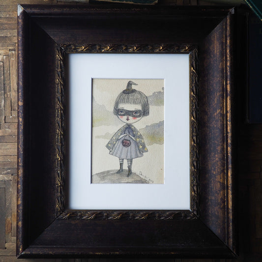 Danita original watercolor pencil painting. Whimsical witch trick-or-treat Halloween night. She has her cape, a mask and a little jack-o-lantern on her hands.