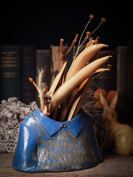 Using hand pinching techniques in of a kind fire glazed ceramics, Idania Salcido, the artist behind Danita Art, sculpted glazed ceramic clay vase containers and flower pots in the shape of vintage blouses. Beautiful accents for your dinner table, showcase or anywhere you want to remind you of family and love.