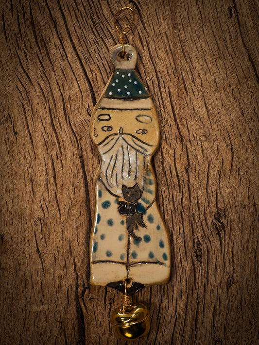 An original Christmas Holiday tree round glazed ceramic ornament handmade by Idania Salcido, the artist behind Danita Art. Glazed carved sgraffito stoneware, hand painted and decorated, it is illustrated by hand with snowmen, Christmas trees, Santa Claus, angels and snow balls and winter themes.