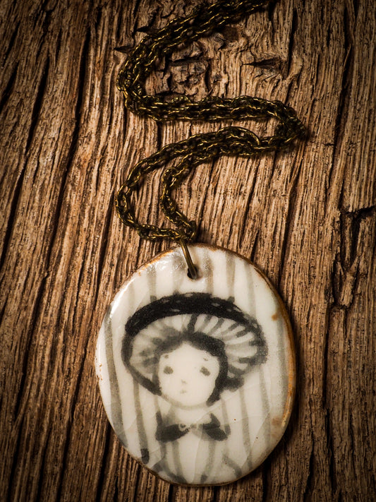 Unique fired ceramic porcelain necklace oval pendant by Idania Salcido, the artist behind Danita Art. Each jewelry setting is hand drawn and illustrated by the artist in her art studio, perfect for any dressing style. A casual gathering with friends or a fancy formal dinner, this necklace is a perfect fashion accessory.