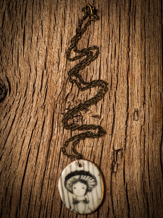 Unique fired ceramic porcelain necklace oval pendant by Idania Salcido, the artist behind Danita Art. Each jewelry setting is hand drawn and illustrated by the artist in her art studio, perfect for any dressing style. A casual gathering with friends or a fancy formal dinner, this necklace is a perfect fashion accessory.