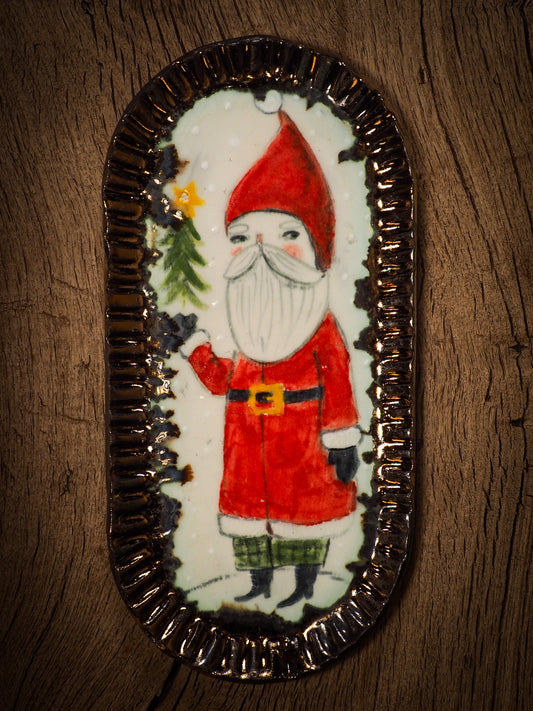 An original Christmas Holiday cake dinner dessert plate round glazed ceramic dinnerware handmade by Idania Salcido, the artist behind Danita Art. Glazed carved sgraffito stoneware, hand painted and decorated, it is illustrated by hand with snowmen, Christmas trees, Santa Claus, angels and snowballs and winter themes.