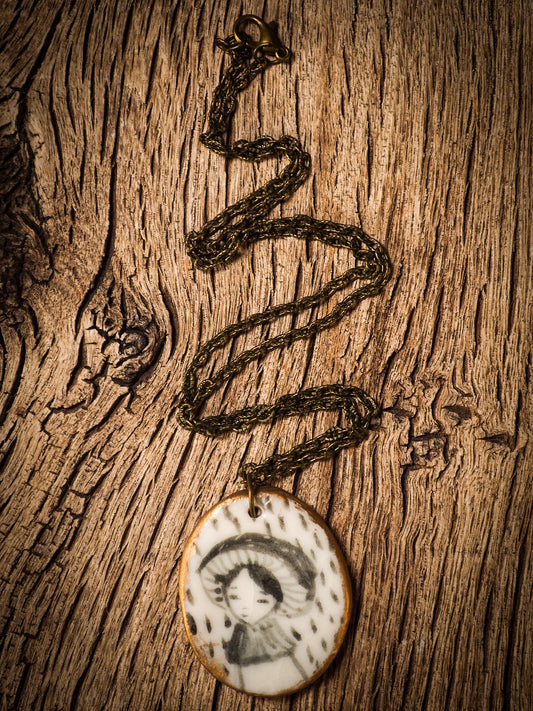 Unique fired ceramic porcelain necklace oval pendant by Idania Salcido, the artist behind Danita Art. Each jewelry setting is hand drawn and illustrated by the artist in her art studio, perfect for any dressing style. A casual gathering with friends or a fancy formal dinner, this necklace is a perfect fashion accessory.