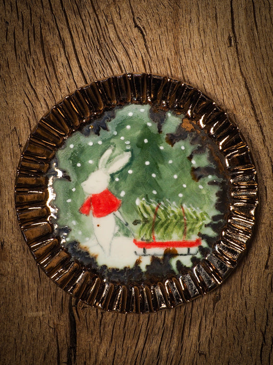 An original Christmas Holiday cake dinner dessert plate round glazed ceramic dinnerware handmade by Idania Salcido, the artist behind Danita Art. Glazed carved sgraffito stoneware, hand painted and decorated, it is illustrated by hand with snowmen, Christmas trees, Santa Claus, angels and snowballs and winter themes.