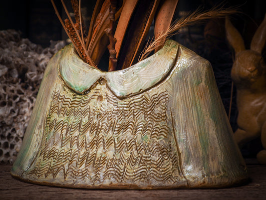 Using hand pinching techniques in of a kind fire glazed ceramics, Idania Salcido, the artist behind Danita Art, sculpted glazed ceramic clay vase containers and flower pots in the shape of vintage blouses. Beautiful accents for your dinner table, showcase or anywhere you want to remind you of family and love.