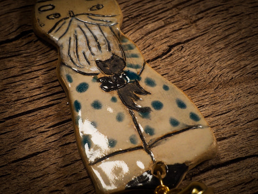 An original Christmas Holiday tree round glazed ceramic ornament handmade by Idania Salcido, the artist behind Danita Art. Glazed carved sgraffito stoneware, hand painted and decorated, it is illustrated by hand with snowmen, Christmas trees, Santa Claus, angels and snow balls and winter themes.