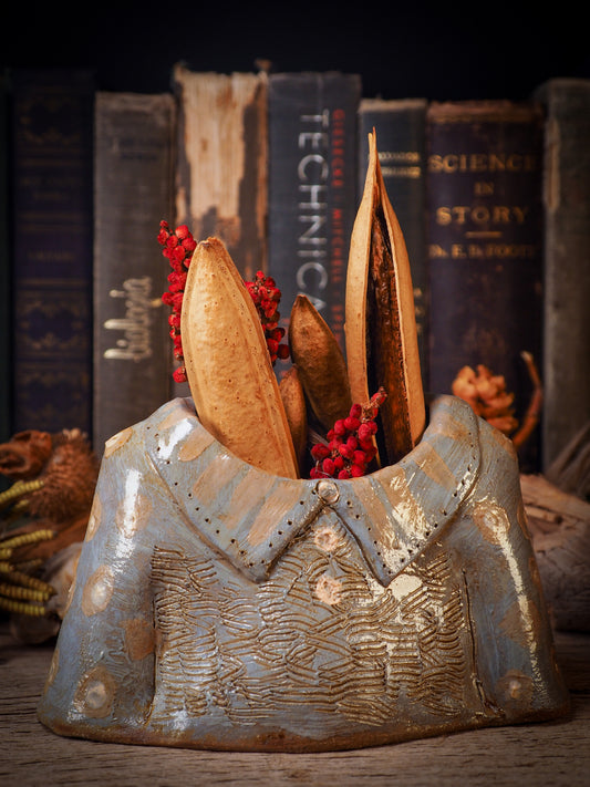 Using hand pinching techniques in of a kind fire glazed ceramics, Idania Salcido, the artist behind Danita Art, sculpted glazed ceramic clay vase containers and flower pots in the shape of vintage blouses. Beautiful accents for your dinner table, showcase or anywhere you want to remind you of family and love.