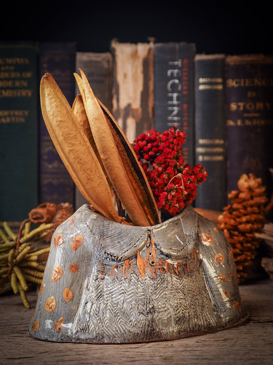 Using hand pinching techniques in of a kind fire glazed ceramics, Idania Salcido, the artist behind Danita Art, sculpted glazed ceramic clay vase containers and flower pots in the shape of vintage blouses. Beautiful accents for your dinner table, showcase or anywhere you want to remind you of family and love.