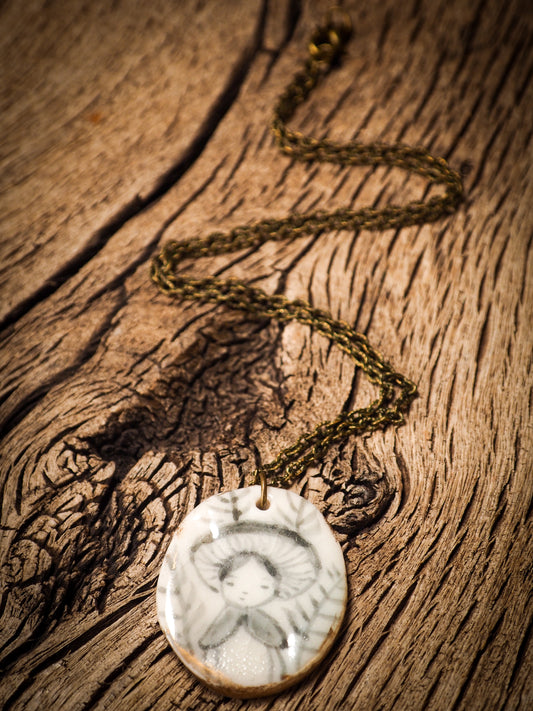 Unique fired ceramic porcelain necklace oval pendant by Idania Salcido, the artist behind Danita Art. Each jewelry setting is hand drawn and illustrated by the artist in her art studio, perfect for any dressing style. A casual gathering with friends or a fancy formal dinner, this necklace is a perfect fashion accessory.