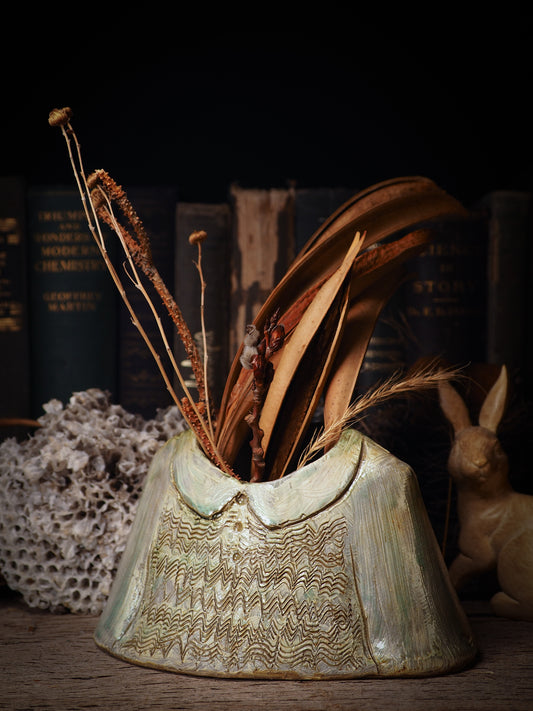 Using hand pinching techniques in of a kind fire glazed ceramics, Idania Salcido, the artist behind Danita Art, sculpted glazed ceramic clay vase containers and flower pots in the shape of vintage blouses. Beautiful accents for your dinner table, showcase or anywhere you want to remind you of family and love.