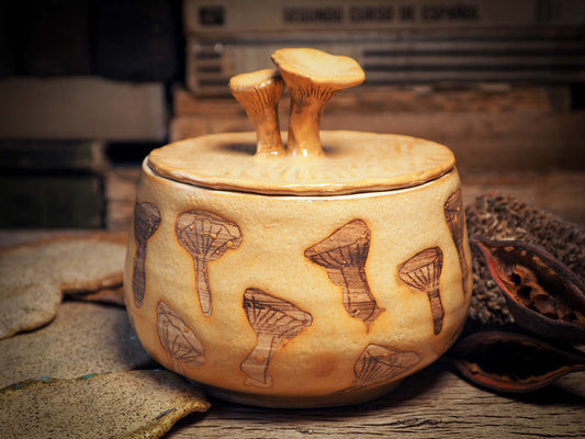 This handmade ceramic jar with lid was created by me, Idania Salcido, the artist behind Danita Art on my studio with lots of love. It features sgraffito mushrooms with beautiful warm color glaze and mushrooms on the lid. It will be perfect to keep everything you love safe and away from prying eyes.
