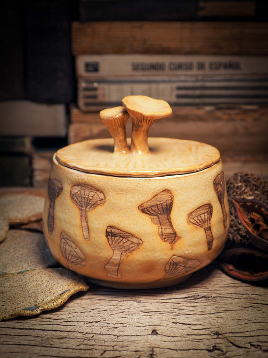 This handmade ceramic jar with lid was created by me, Idania Salcido, the artist behind Danita Art on my studio with lots of love. It features sgraffito mushrooms with beautiful warm color glaze and mushrooms on the lid. It will be perfect to keep everything you love safe and away from prying eyes.