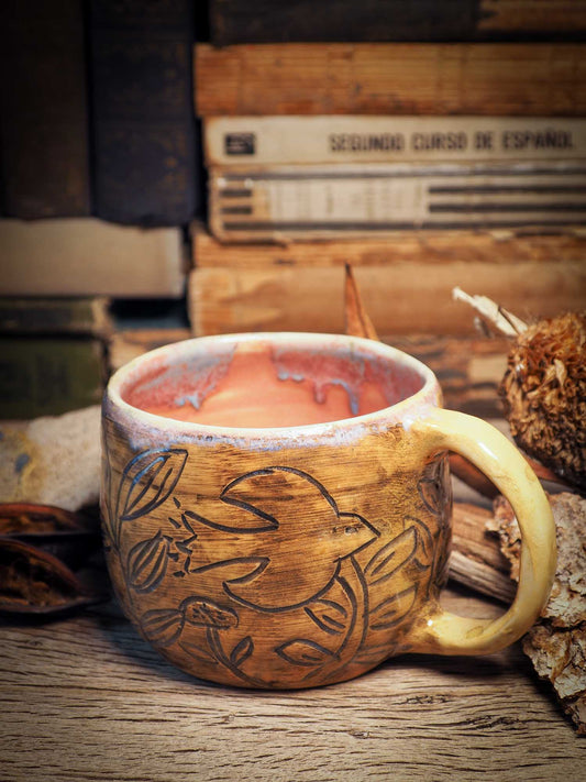 This handmade carved ceramic coffee mug was created by me, Idania Salcido, the artist behind Danita Art, and fired and glazed on my own kiln. The inside is a beautiful combination of pink and blue glazes, swirling and combining inside like cream and coffee. Carved birds fly over a field, free and going far, far away.