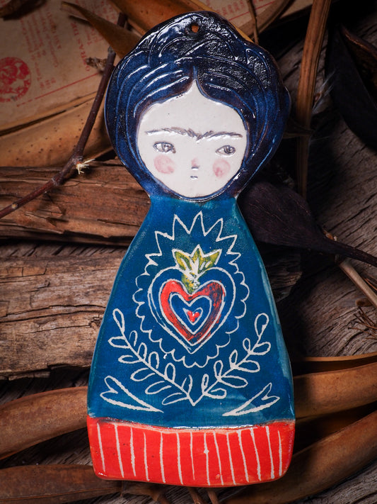 An original Christmas Holiday tree glazed ceramic ornament handmade by Idania Salcido, the artist behind Danita Art. Glazed carved sgraffito stoneware, hand painted and decorated, it is illustrated by hand with Frida Kahlo, Mexican motifs and bold, bright and colorful ceramic glazes.