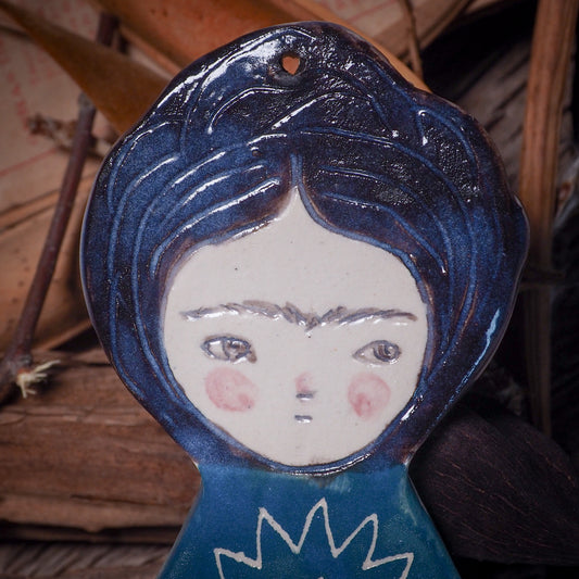 An original Christmas Holiday tree glazed ceramic ornament handmade by Idania Salcido, the artist behind Danita Art. Glazed carved sgraffito stoneware, hand painted and decorated, it is illustrated by hand with Frida Kahlo, Mexican motifs and bold, bright and colorful ceramic glazes.