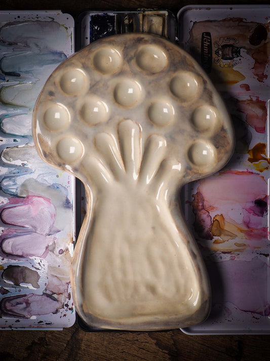 Each artist paint palette by Idania Salcido, the artist behind Danita Art, is hand sculpted and fired with paint and scratch resistant glazes and with enough paint wells to keep and mix colors at ease. Acrylics, Oils and watercolors can be used, it is perfect for any medium! Clean with water or mineral spirits.